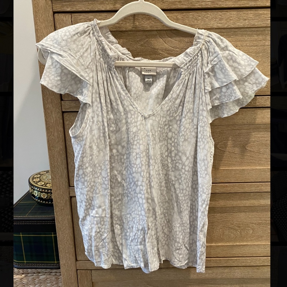 White and light grey leopard print v neck short sleeve blouse